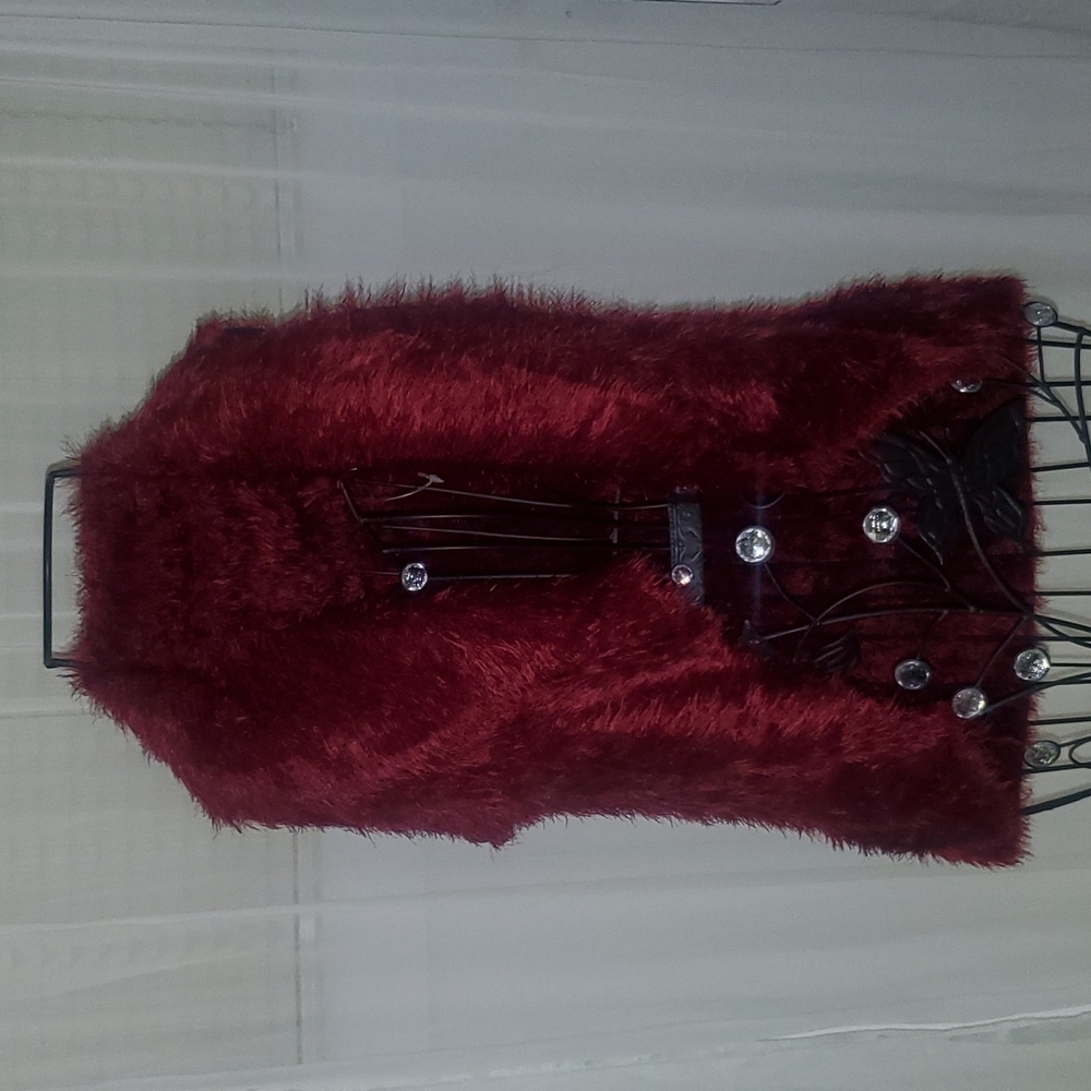 Very soft red holiday (faux fur) vest.